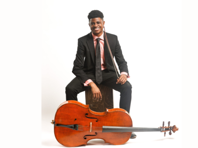 Man posting with a cello